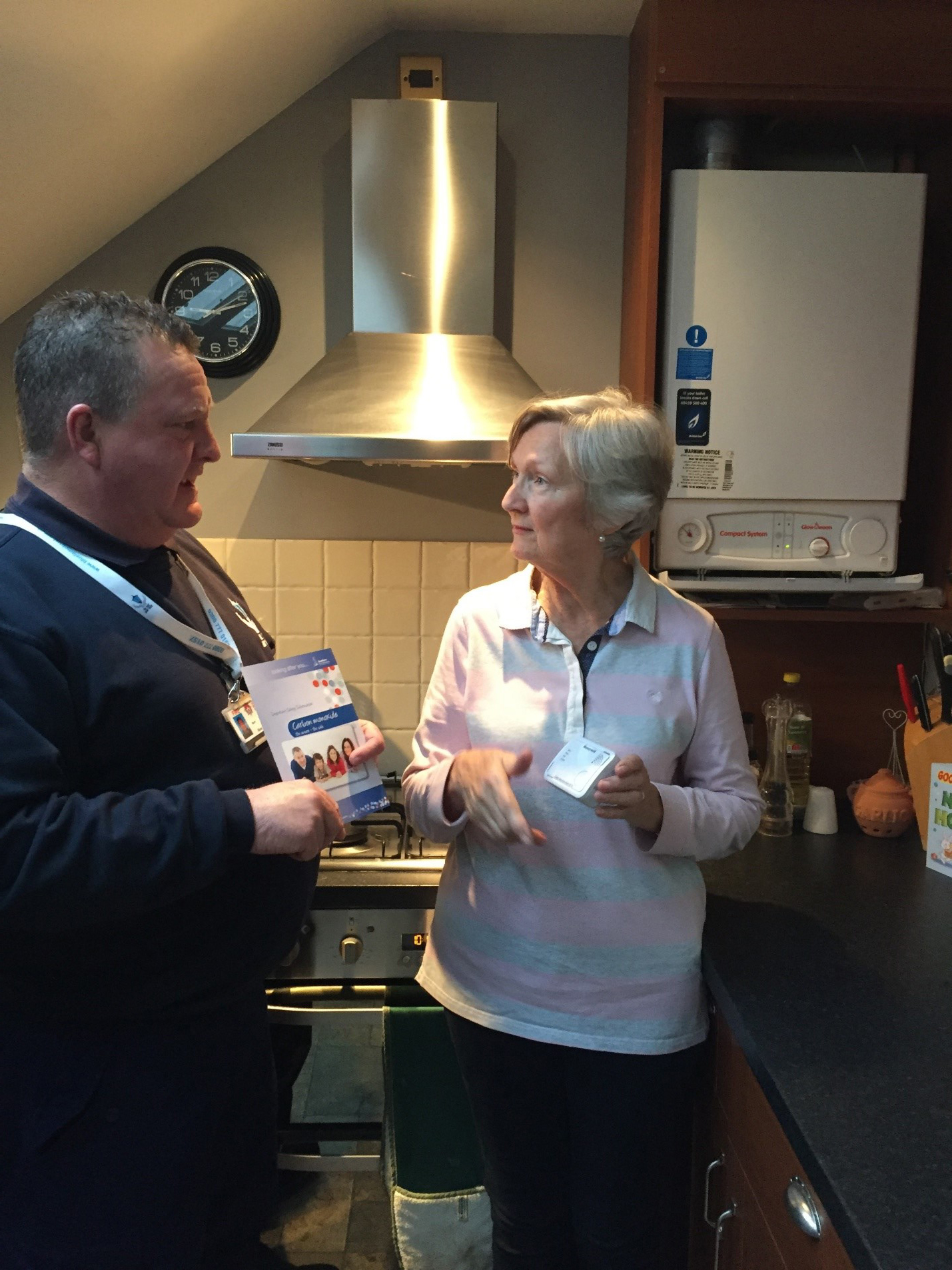 Image Image:  Lead Fitter Mark Scovell talks to a client about the importance of fitting a carbon monoxide detector.