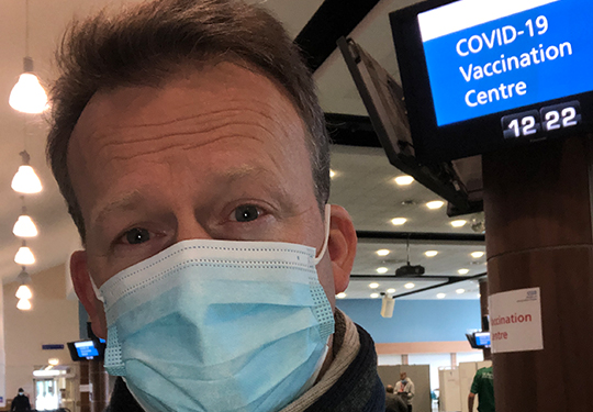 Eddie volunteers as a vaccinator at Epsom Racecourse