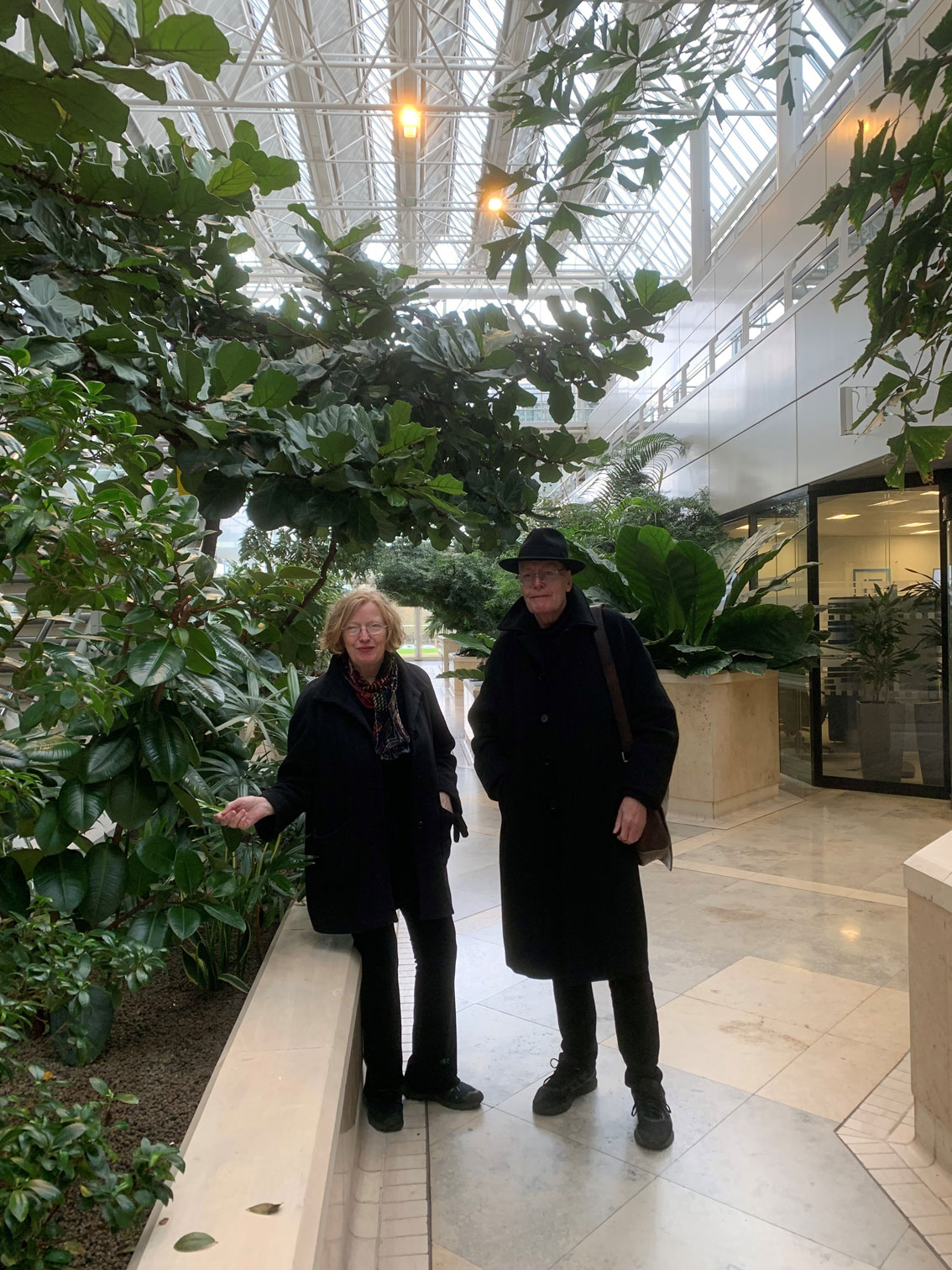 Michele and Bill admire the progress of the plants inside Ermyn House that Michele chose back in the 1980s