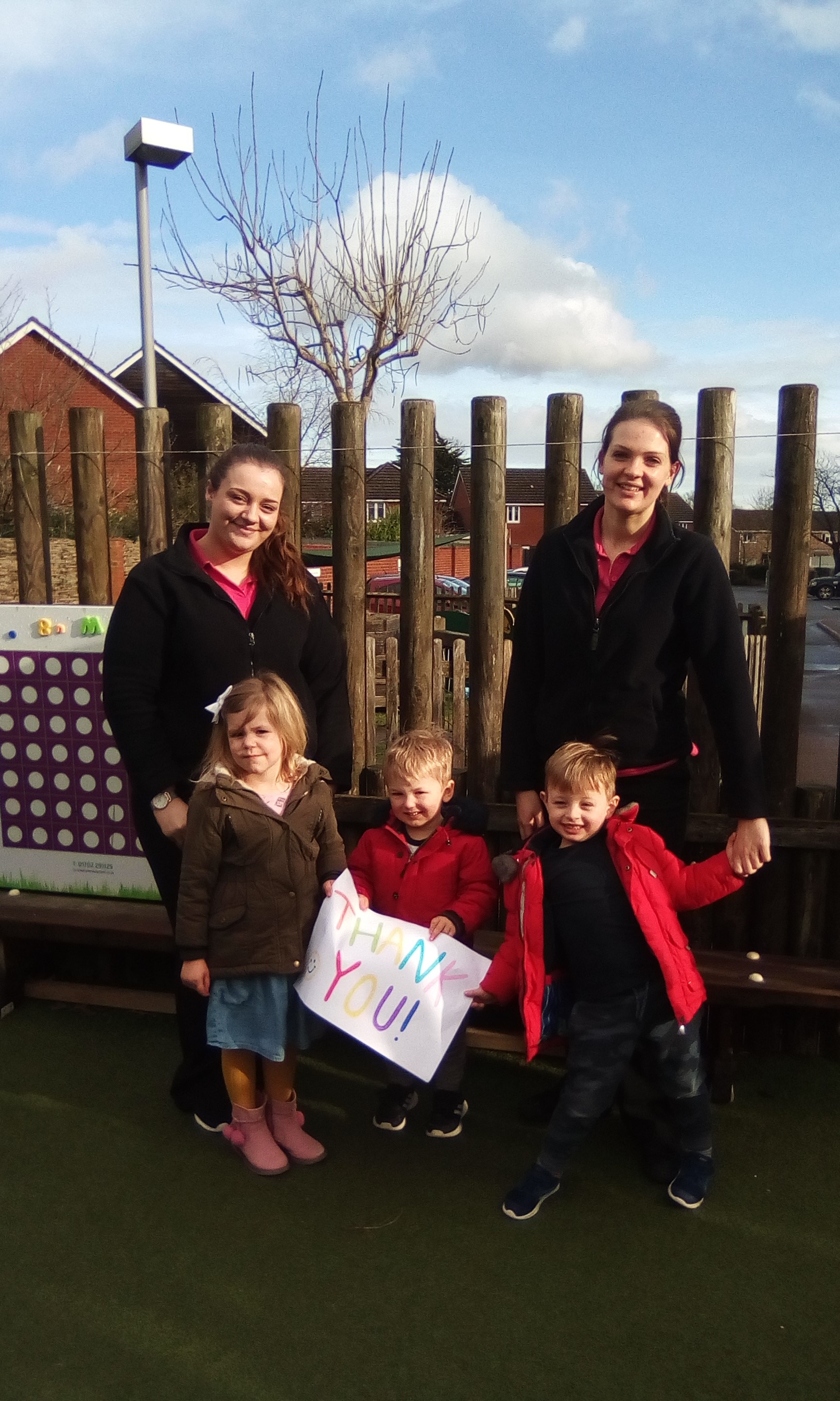 Image Saplings staff and children say thank you to ExxonMobil Fawley for the donation towards COVID-19 testing kits.