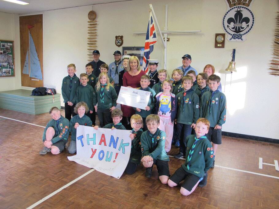 Image Photo  Alison Jones, Community Affairs Manager at ExxonMobil Fawley, presents a cheque for 2,000 to Hythe Sea Scouts.